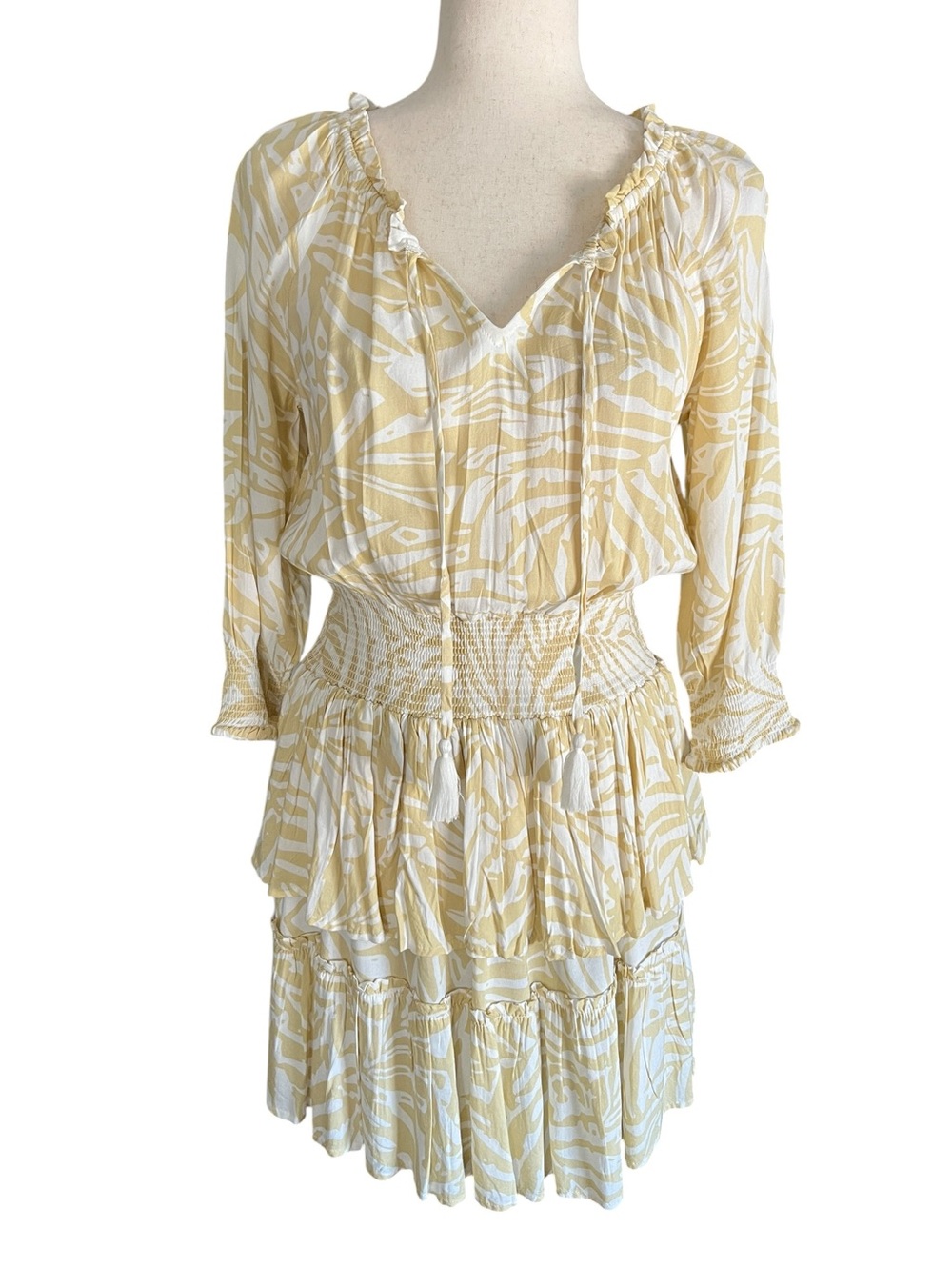 Patrons of Peace palm leaf tiered ruffle skirt and a smocked waist mini dress